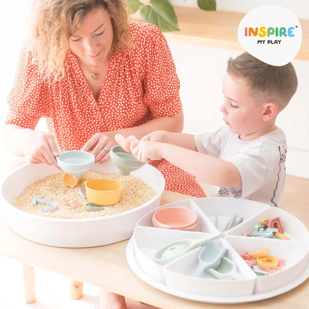 Mother and child playing with PlayTRAY and Inspire My Play accessories