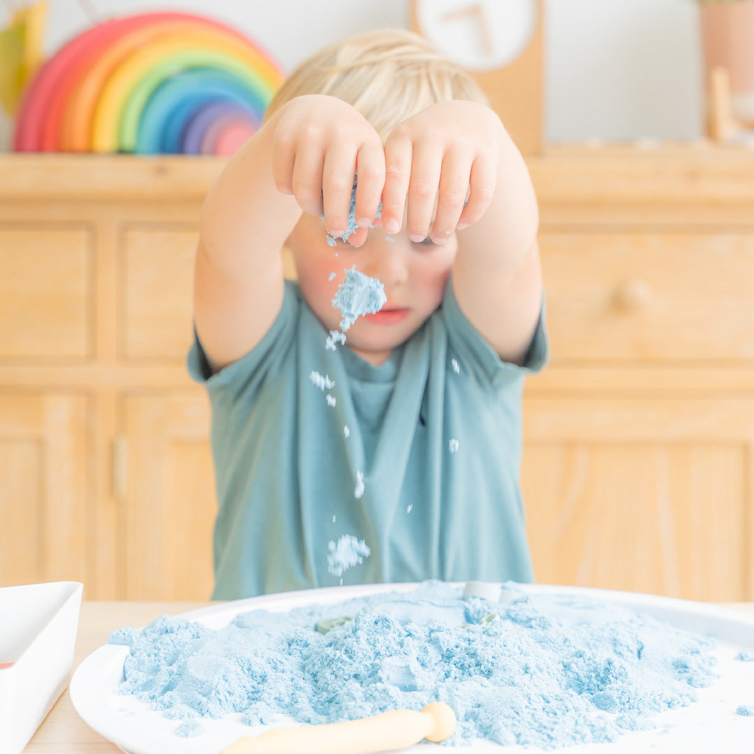 Boy playing with sand