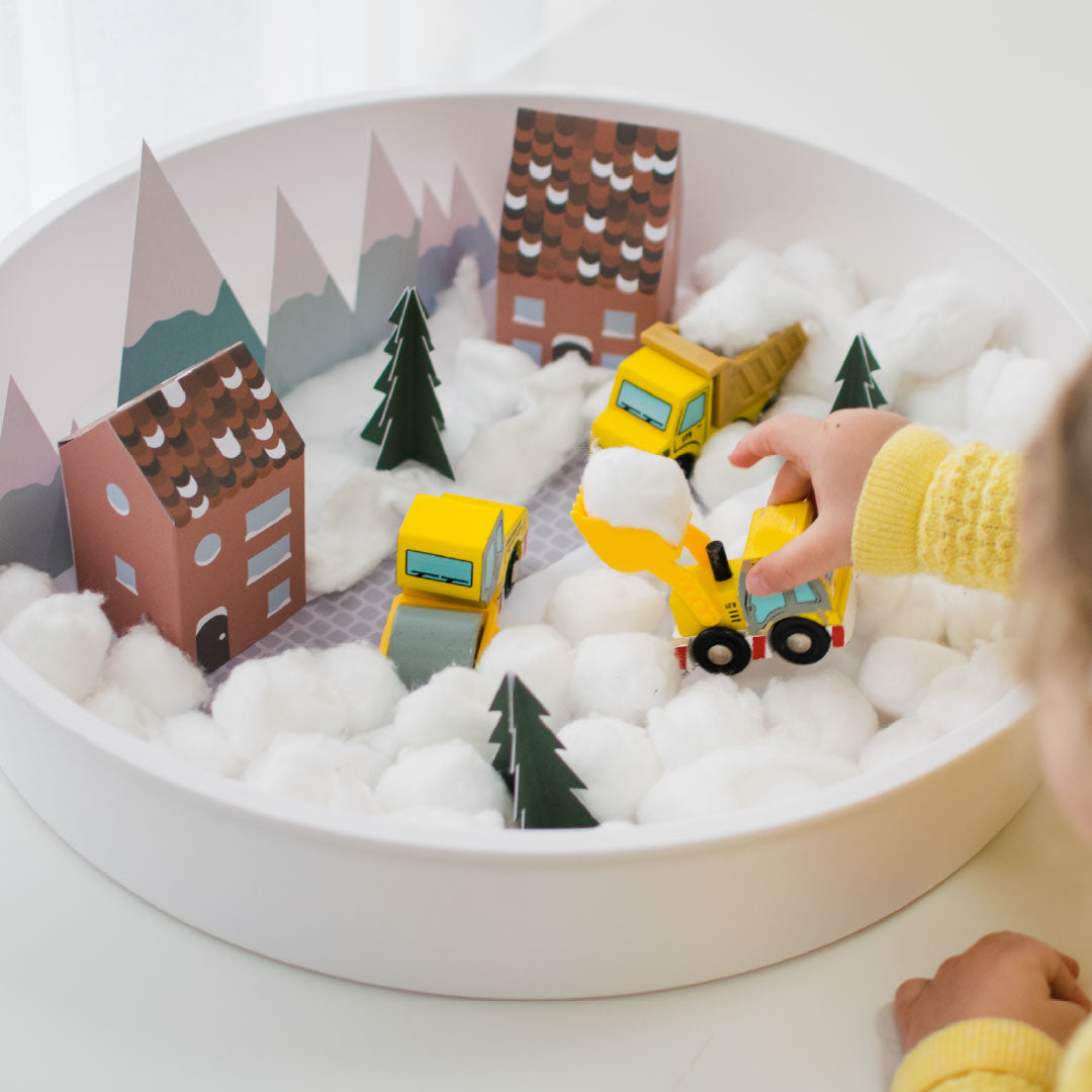 Child playing with Christmas small world