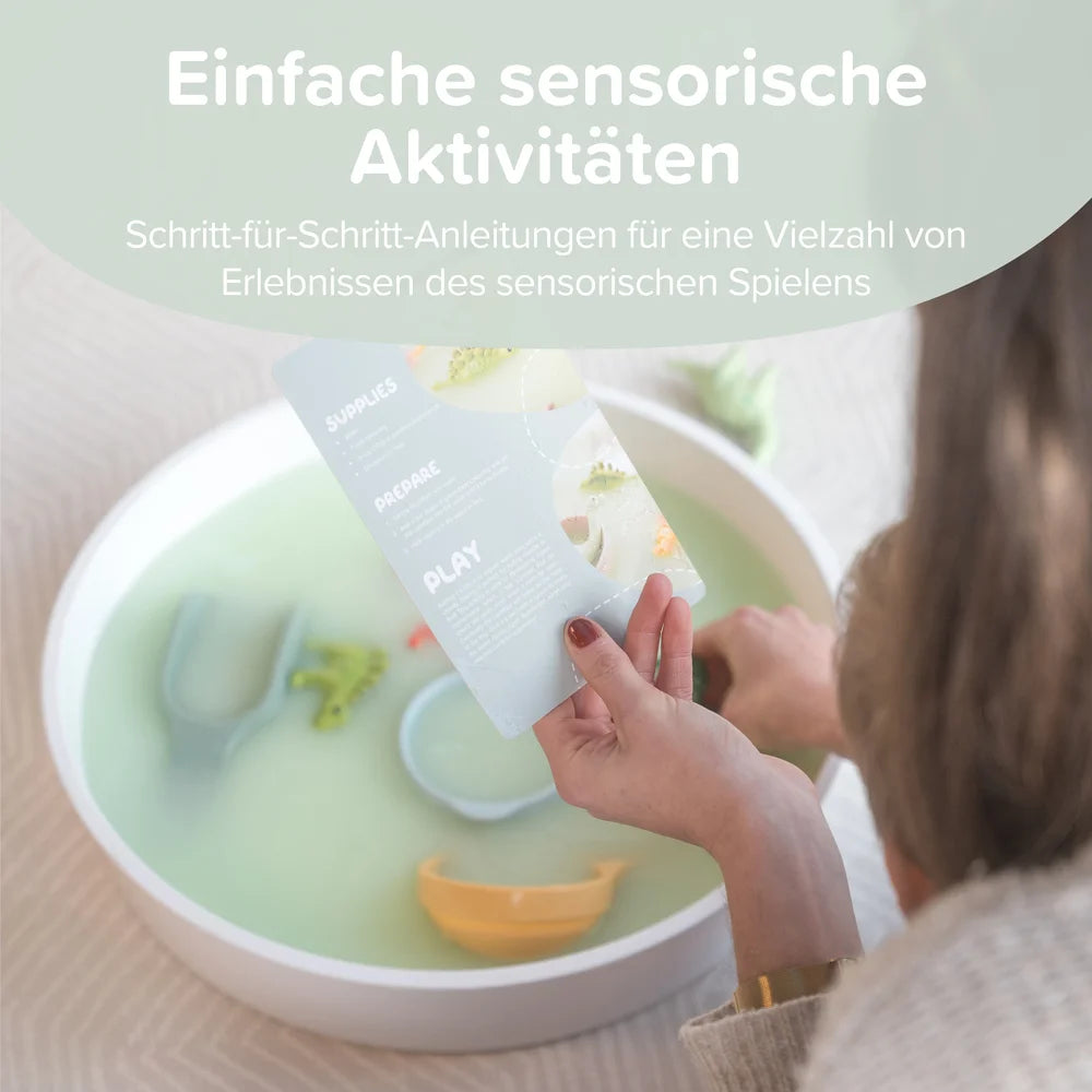 Child playing with sensory toys in a play tray, with text about sensory play activities.