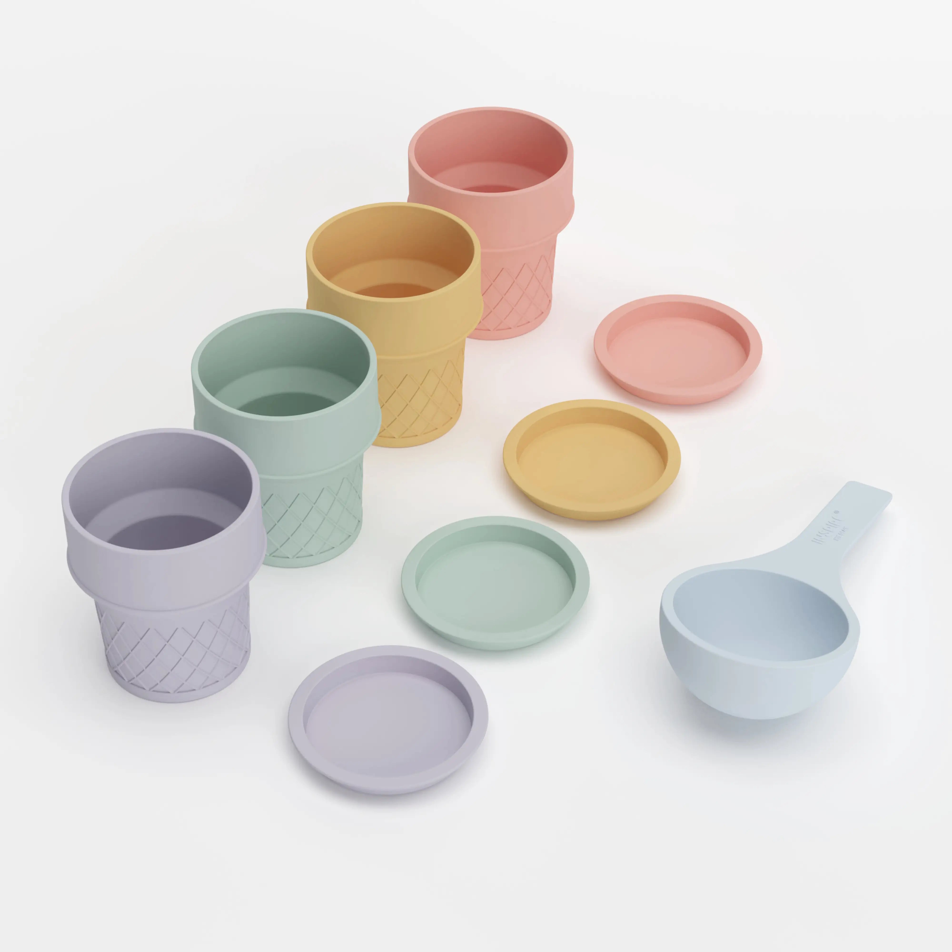 A set of pastel-coloured ice cream cones lined up with matching coloured lids and a blue silicone scoop on a white background.