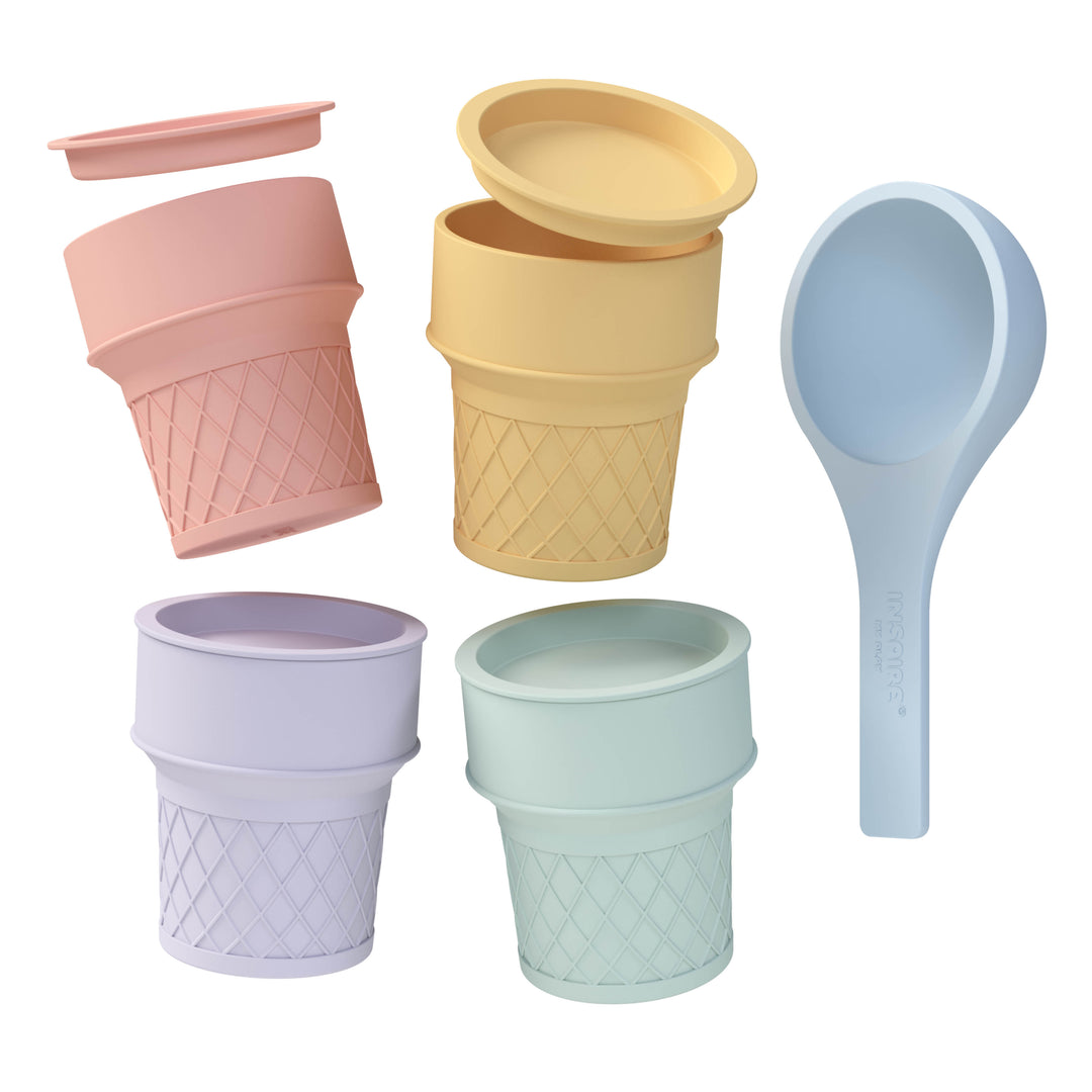 A set of silicone ice cream cones with matching coloured lids and a scoop in pastel colours, including pink, yellow, purple and mint green, arranged on a plain white background.
