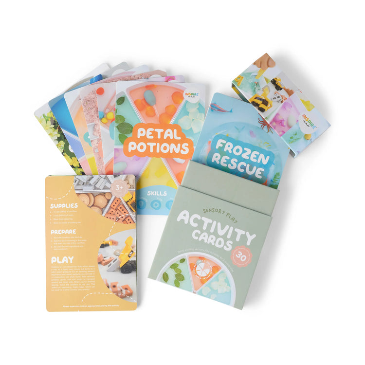 A set of 30 sensory play activity cards in a cardboard box. Visible titles include 'Petal Potions,' and 'Frozen Rescue.'