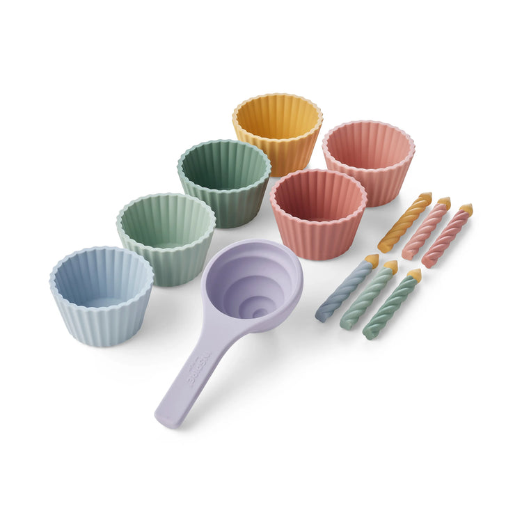 Silicone baking cupcake play set with a lavender-coloured scoop and six silicone cupcake cases in pastel shades of blue, green, pink, and yellow, arranged on a clean white background.