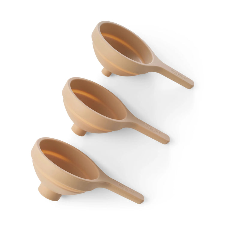 Three beige-coloured silicone collapsible funnels for sensory play, sand play and water play arranged diagonally on a clean white background.