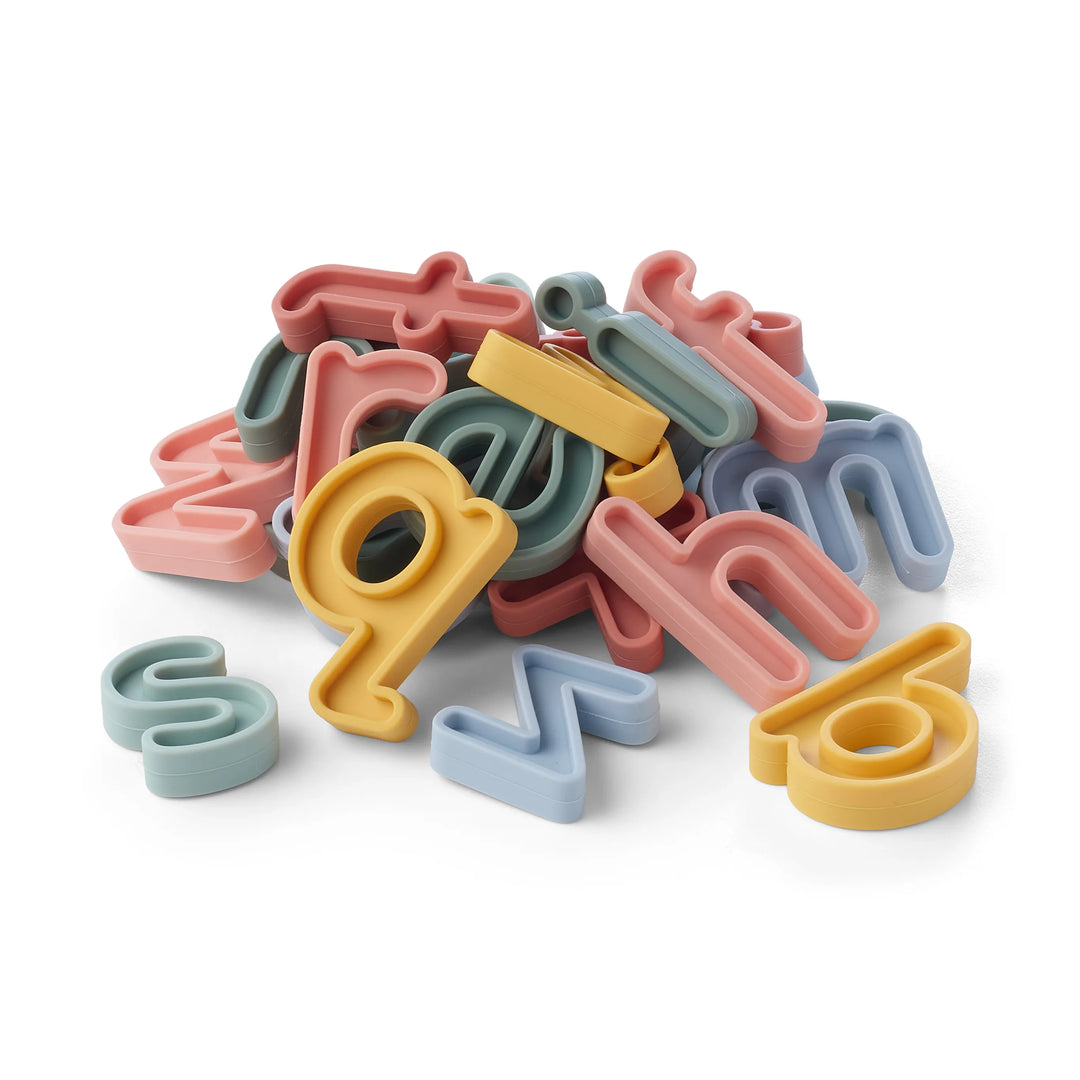 A set of coloured sensory play lowercase alphabet letters for phonics and sensory play in pastel shades of pink, blue, green, and yellow on a clean white background.
