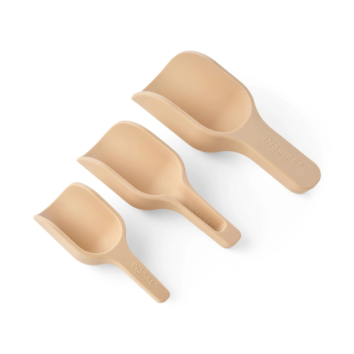 Three different sized silicone sensory play nesting scoops in beige arranged diagonally on a clean white background. The brand name 'INSPIRE MY PLAY' is embossed on the handles.
