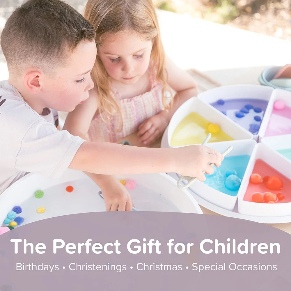 Two children playing with sensory tongs and pom poms in the Inspire My Play PlayTRAY with text 'The Perfect Gift for Children' below.