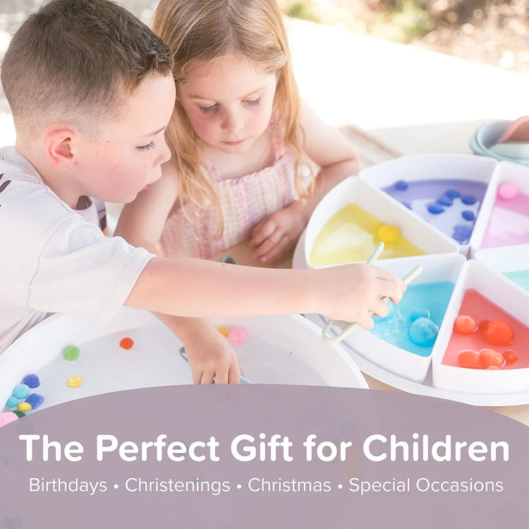 Two children playing with sensory tongs and pom poms in the Inspire My Play PlayTRAY with text 'The Perfect Gift for Children' below.