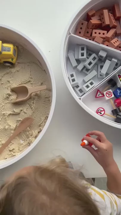 Sensory PlayTRAY small world setup with play sand cement, mini bricks, mini blocks and toy diggers.