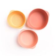 Three silicone bowls next to one another with text highlighting that they are 100% food-grade